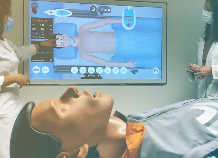 medical simulator and manikin being used for education purposes