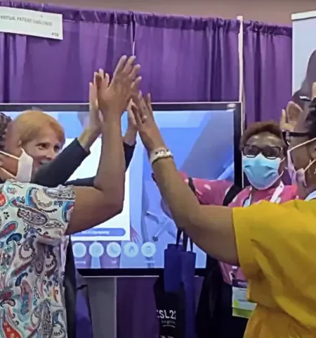 four women celebrating winning the Virtual Patient Challenge at INACSL 2022