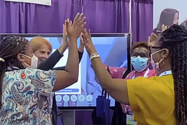 four women celebrating winning the Virtual Patient Challenge at INACSL 2022